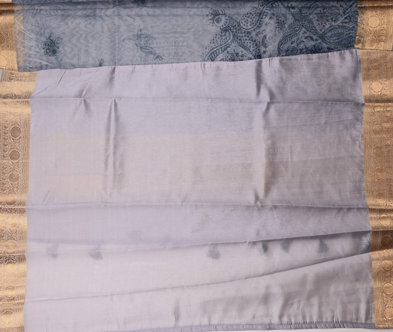 Organza Saree blue color with allover prints, small gold zari border, short pallu and plain blouse