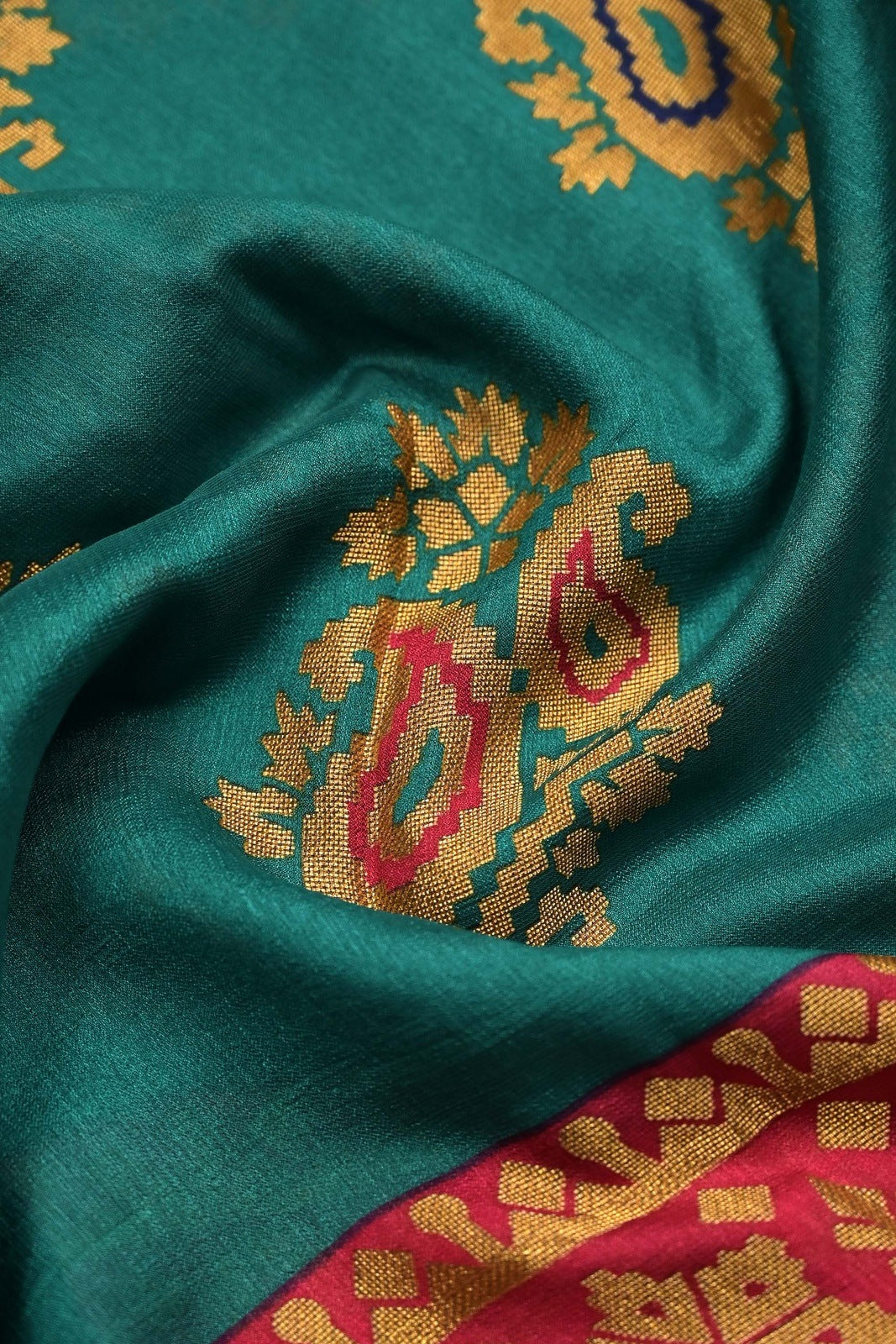 Soft jute saree green and red color allover prints with contrast border and brocade blouse