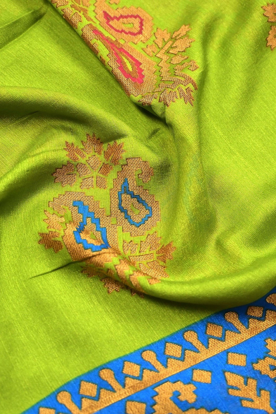 Soft jute saree green and blue color allover prints with contrast border and brocade blouse