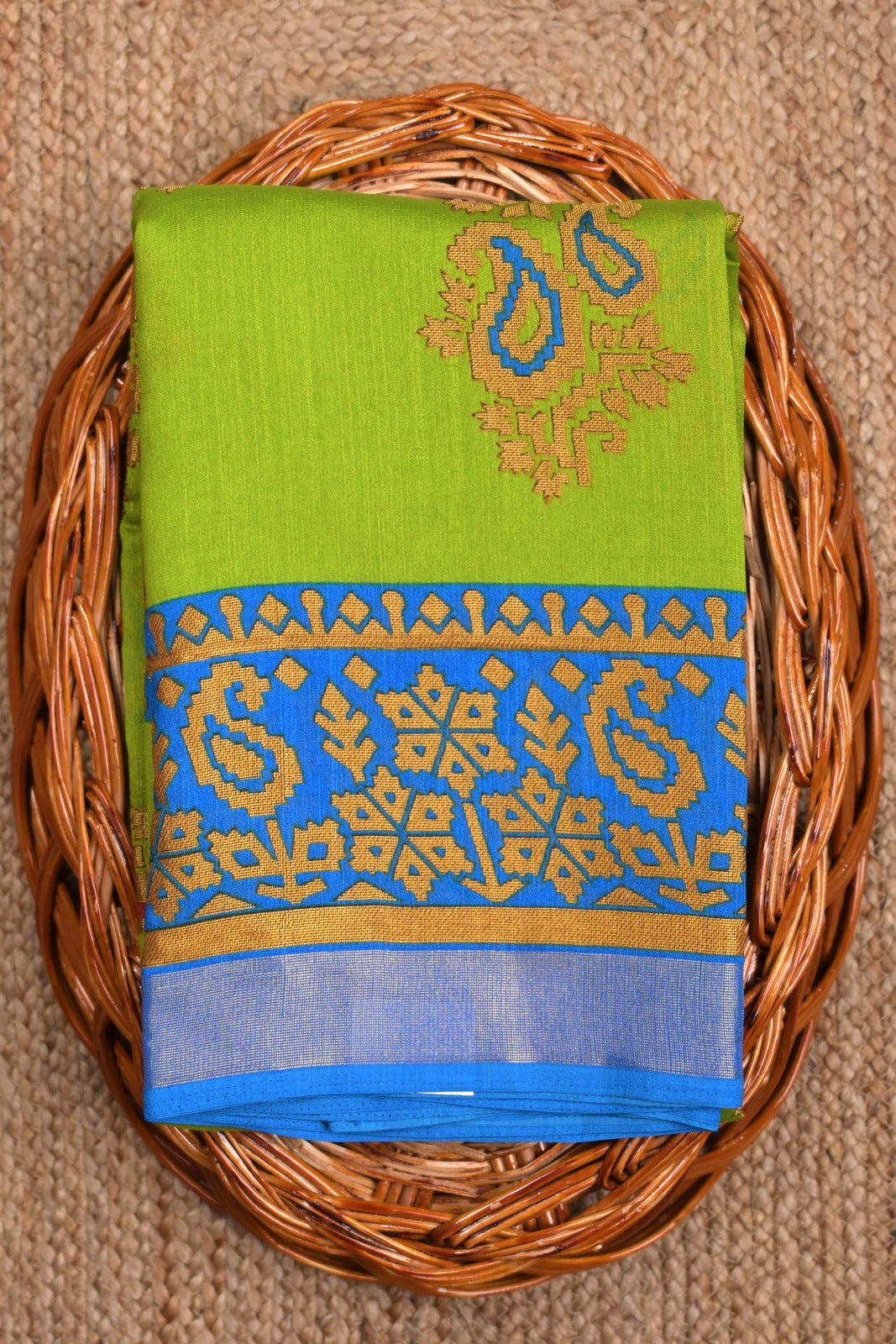 Soft jute saree green and blue color allover prints with contrast border and brocade blouse