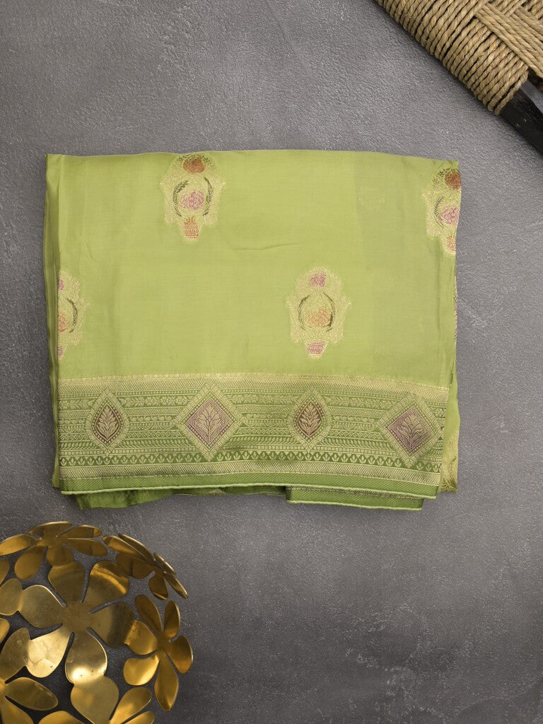 Dola silk fancy saree pista green color allover prints & zari border with printed pallu and attached blouse