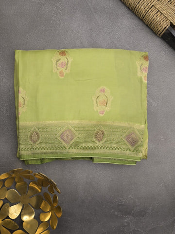 Dola silk fancy saree pista green color allover prints & zari border with printed pallu and attached blouse