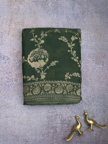 Chinnon fancy saree dark green color allover zari weaves & zari border with rich pallu and plain blouse
