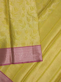 Banaras tissue fancy saree greenish yellow color allover weaves & zari border with running pallu and self blouse