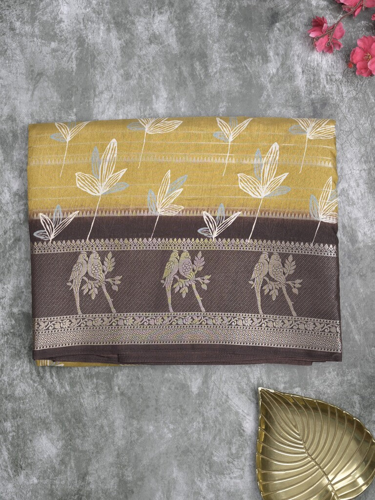 Dola silk fancy saree light mustard yellow color allover prints & contrast zari border with printed pallu and printed blouse