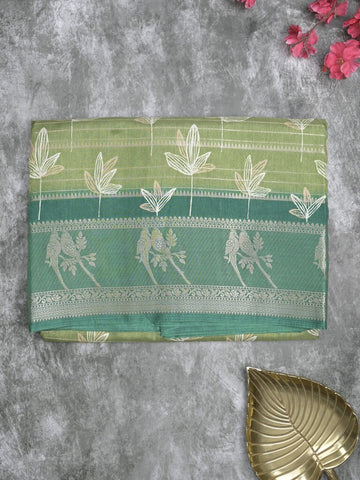 Dola silk fancy saree leaf green color allover prints & contrast zari border with printed pallu and printed blouse
