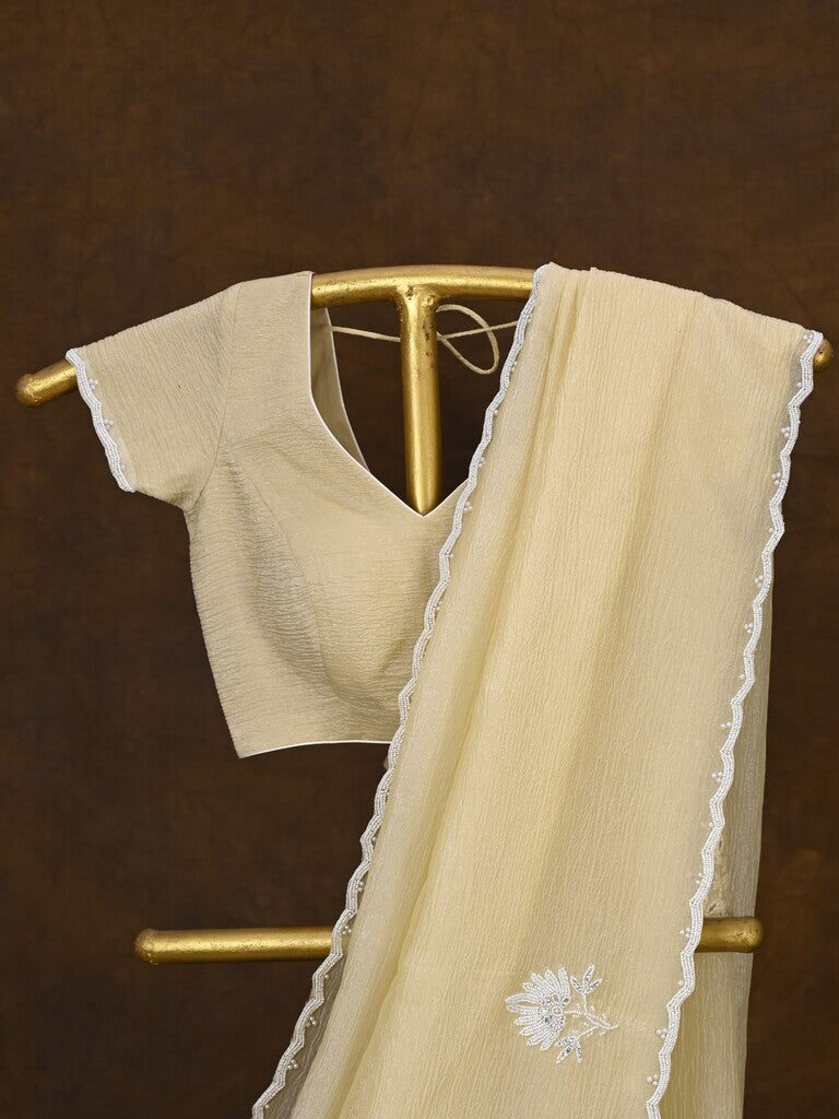 Crush organza fancy saree cream color allover embroidery motifs & embroidery border with running pallu and stitched blouse