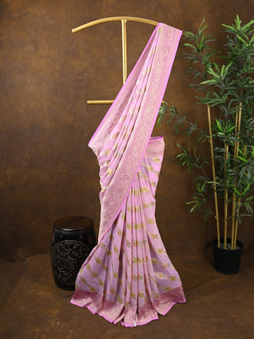Pure georgette fancy saree light pink color allover zari motifs & zari border with rich pallu and plain blouse