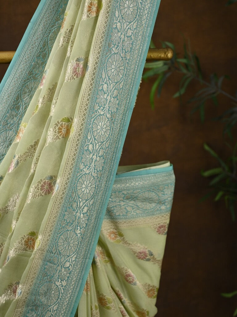 Pure georgette fancy saree pastel yellow color allover zari motifs & zari border with rich pallu and plain blouse