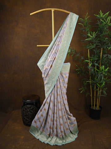 Pure georgette fancy saree pastel purple color allover zari motifs & zari border with rich pallu and plain blouse