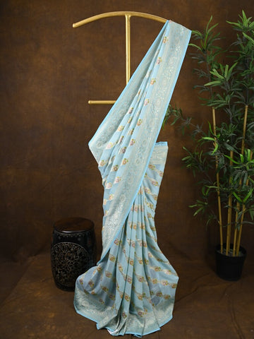 Pure georgette fancy saree light blue color allover zari motifs & zari border with rich pallu and plain blouse