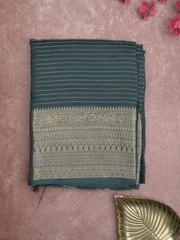 Georgette fancy saree dark green color allover stripes & zari border with short pallu and self blouse