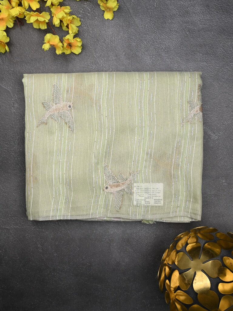 Jute tissue fancy saree light pastel green color allover sequence work with short pallu and contrast blouse