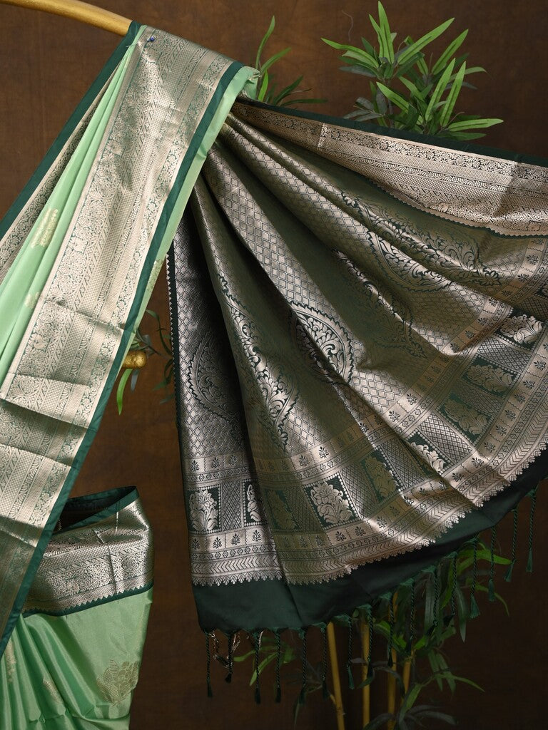 Kanchi pattu saree pista green color allover zari weaves & kanchi border with rich pallu and contrast plain blouse