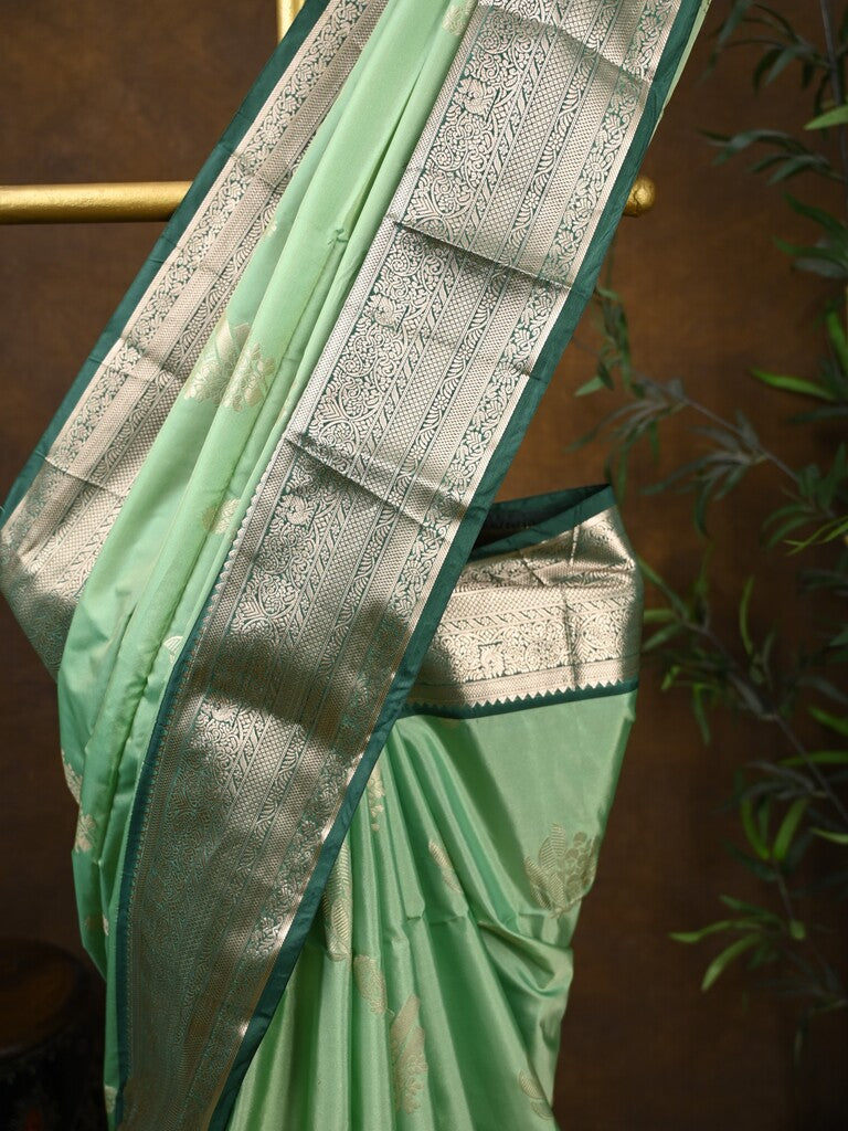 Kanchi pattu saree pista green color allover zari weaves & kanchi border with rich pallu and contrast plain blouse