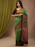 Kanchi pattu saree leaf green color allover zari weaves & zari border with contrast pallu and plain contrast blouse