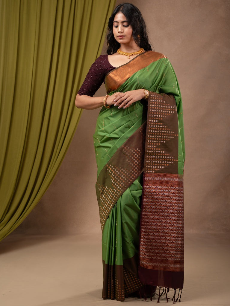 Kanchi pattu saree leaf green color allover zari weaves & zari border with contrast pallu and plain contrast blouse