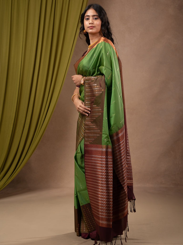 Kanchi pattu saree leaf green color allover zari weaves & zari border with contrast pallu and plain contrast blouse