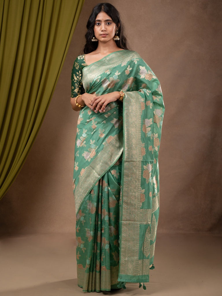 Dupion fancy saree lux green color allover weaves & zari border with zari pallu and plain self blouse