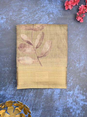 Jute tissue fancy saree snuff color allover prints & zari border with short pallu and plain blouse