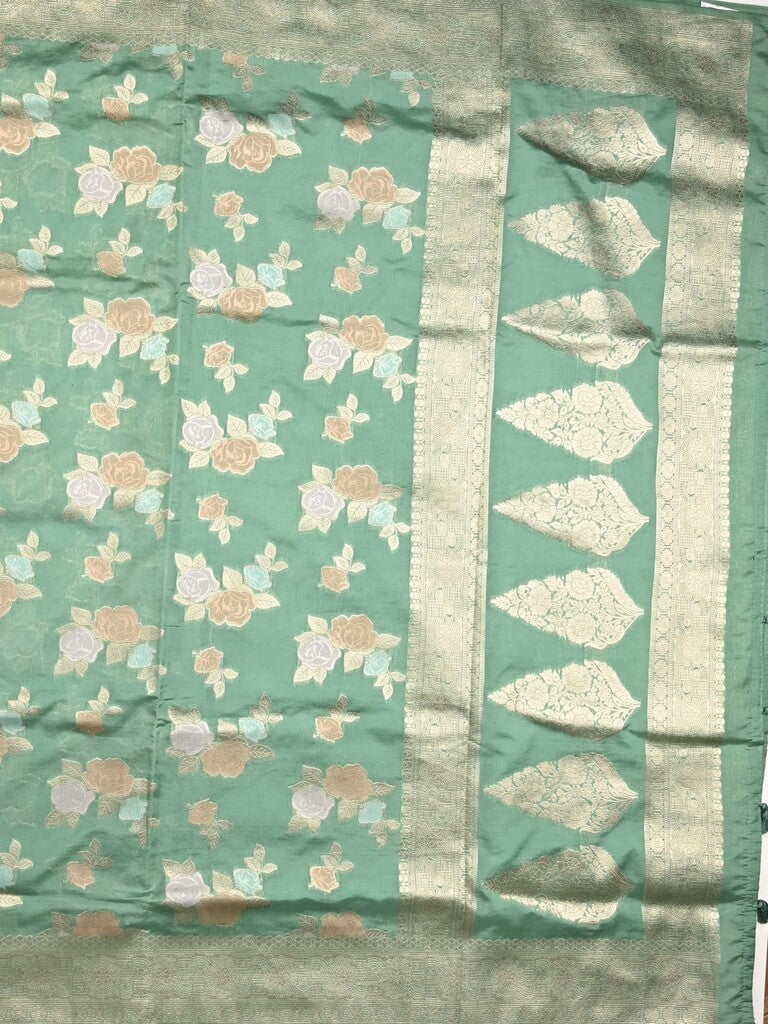 Dupion fancy saree lux green color allover weaves & zari border with zari pallu and plain self blouse