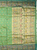 Dupion fancy saree light green color allover zari motifs & zari border with rich pallu and attached self blouse