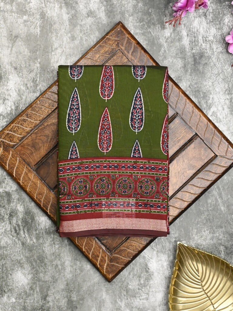 Maheshwari fancy saree bottle green color allover prints & printed zari border with printed pallu and contrast blouse