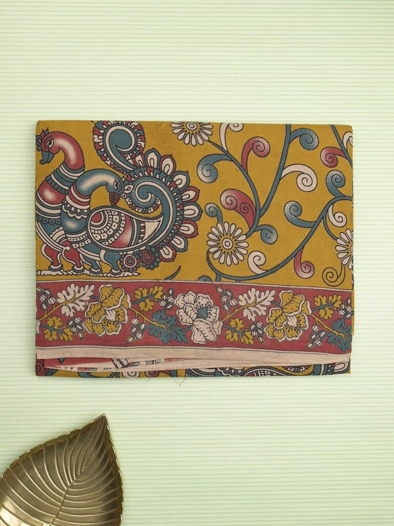 Kalamakari cotton saree golden yellow color allover prints & printed border with printed pallu and contrast blouse