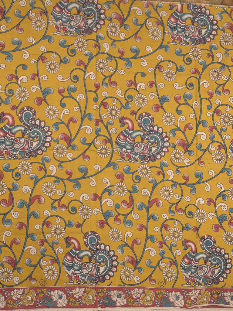 Kalamakari cotton saree golden yellow color allover prints & printed border with printed pallu and contrast blouse