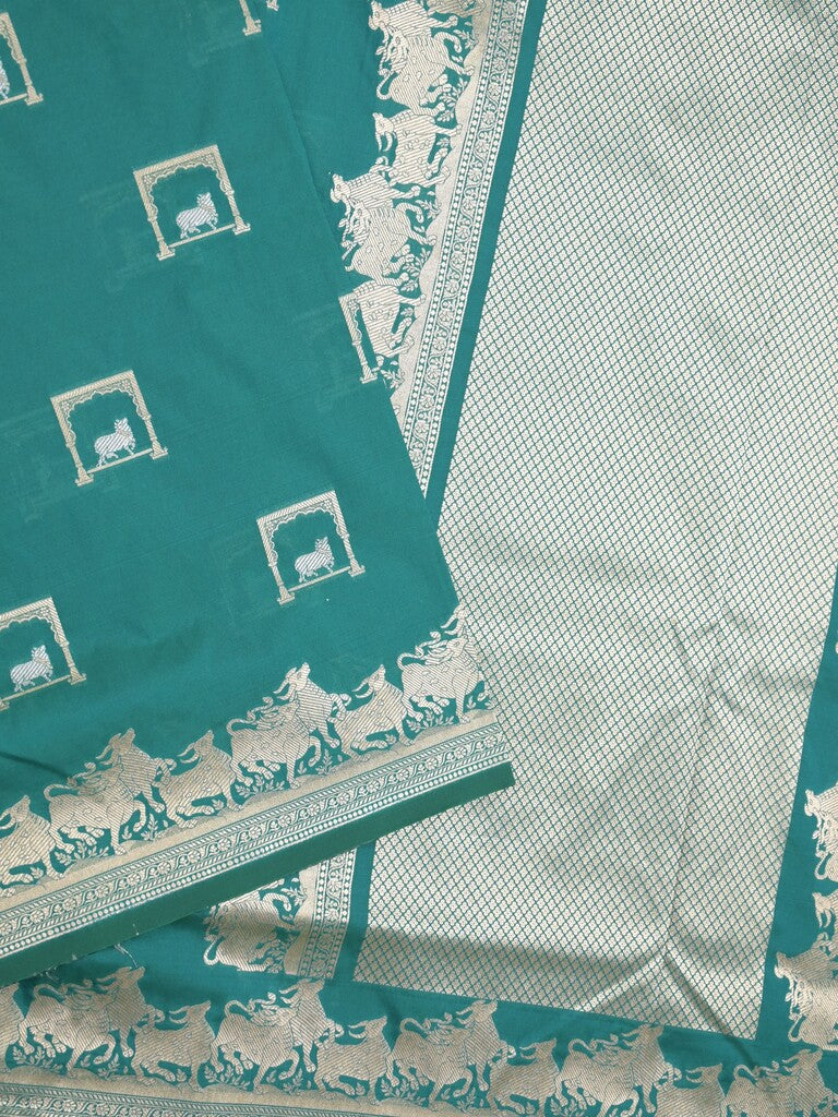 Raw mango fancy saree peacock blue color allover zari weaves & zari border with zari border and attached blouse