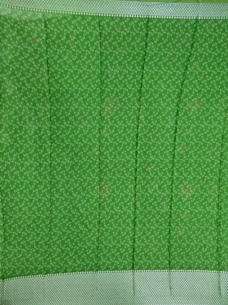 Munga fancy saree parrot green color allover prints & zari border with short pallu and printed blouse