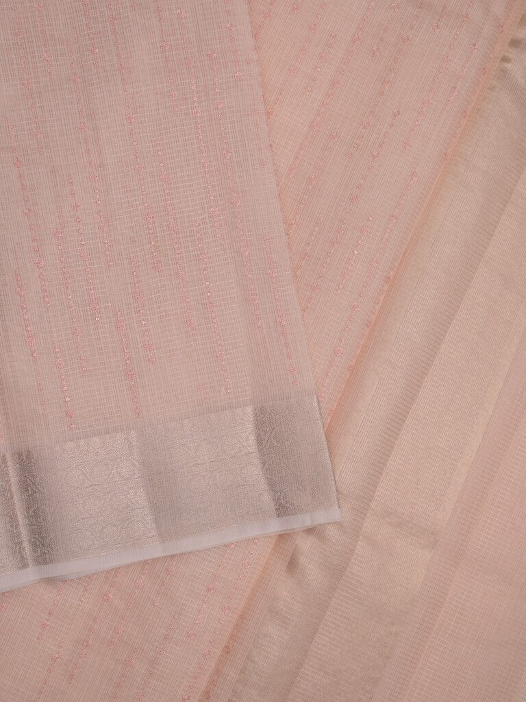 Kota tissue fancy saree light peach color allover embroidery & zari border with short pallu and plain self blouse