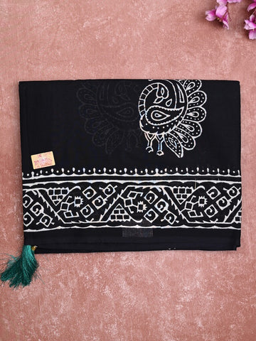 Mul cotton saree black color allover prints & printed border with printed pallu and plain contrast blouse