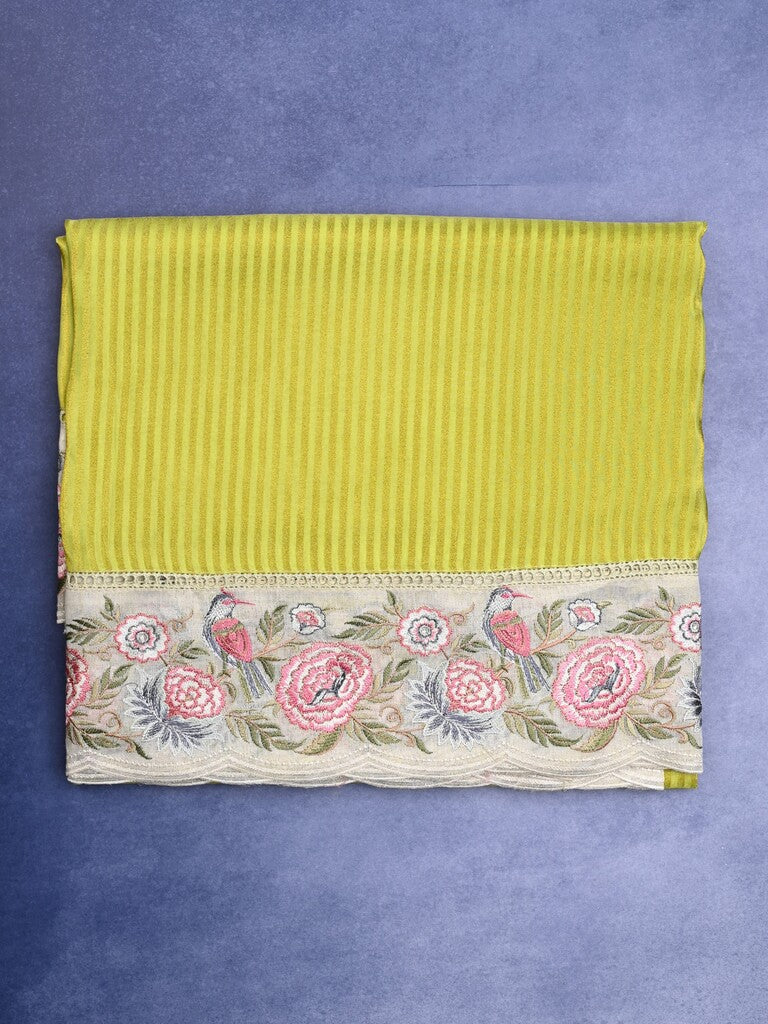 Dola tissue fancy saree parrot green color allover stripes & designer fancy border with running pallu and embroidery blouse