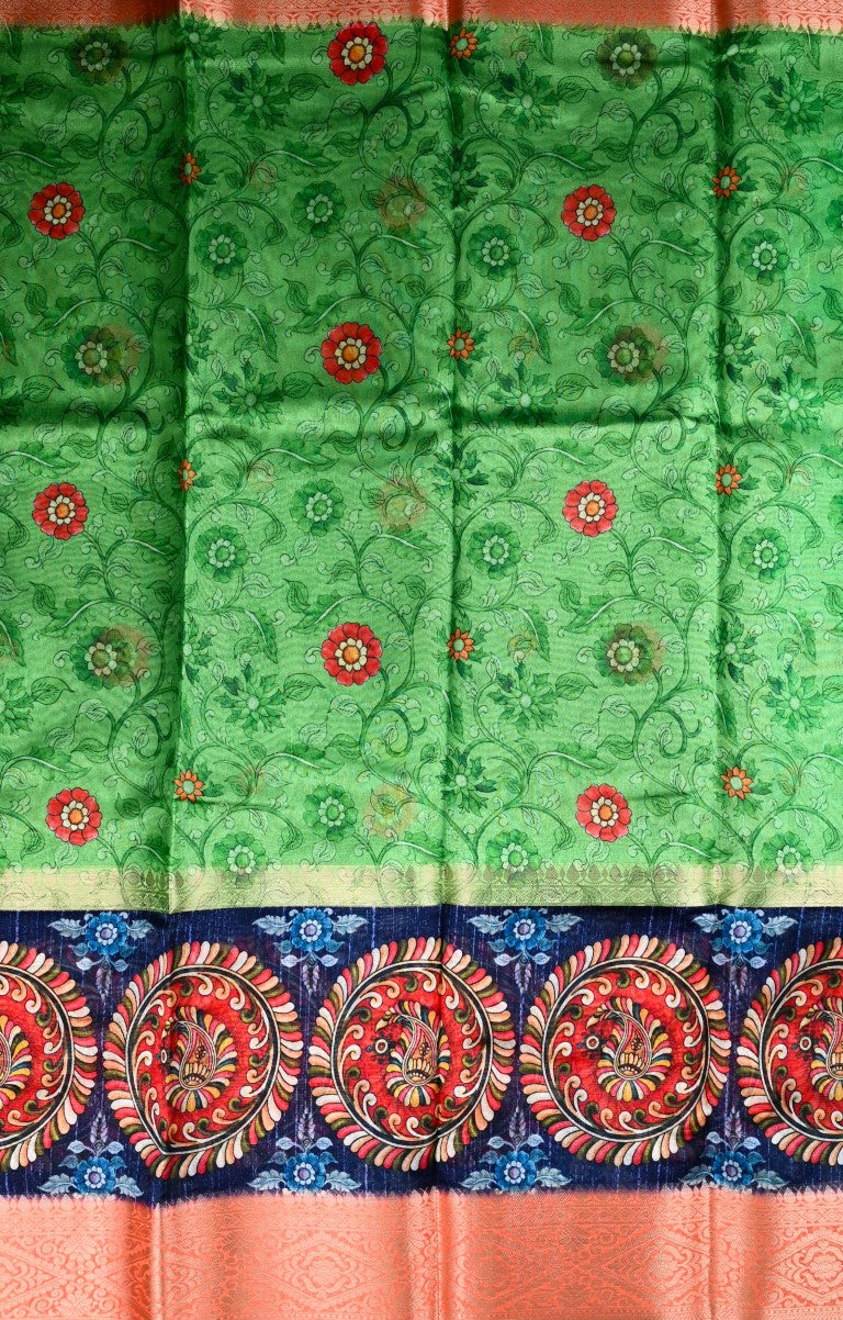 Dupion patola saree green color with allover digital kalamkari prints, short pallu, big zari border and printed blouse.