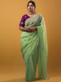 Organza shimmer pista green color allover embroidery butis & embroidery border with running pallu and attached blouse