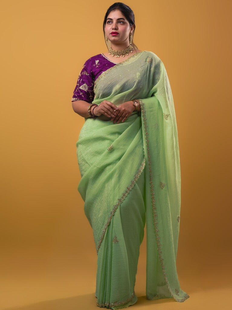 Organza shimmer pista green color allover embroidery butis & embroidery border with running pallu and attached blouse