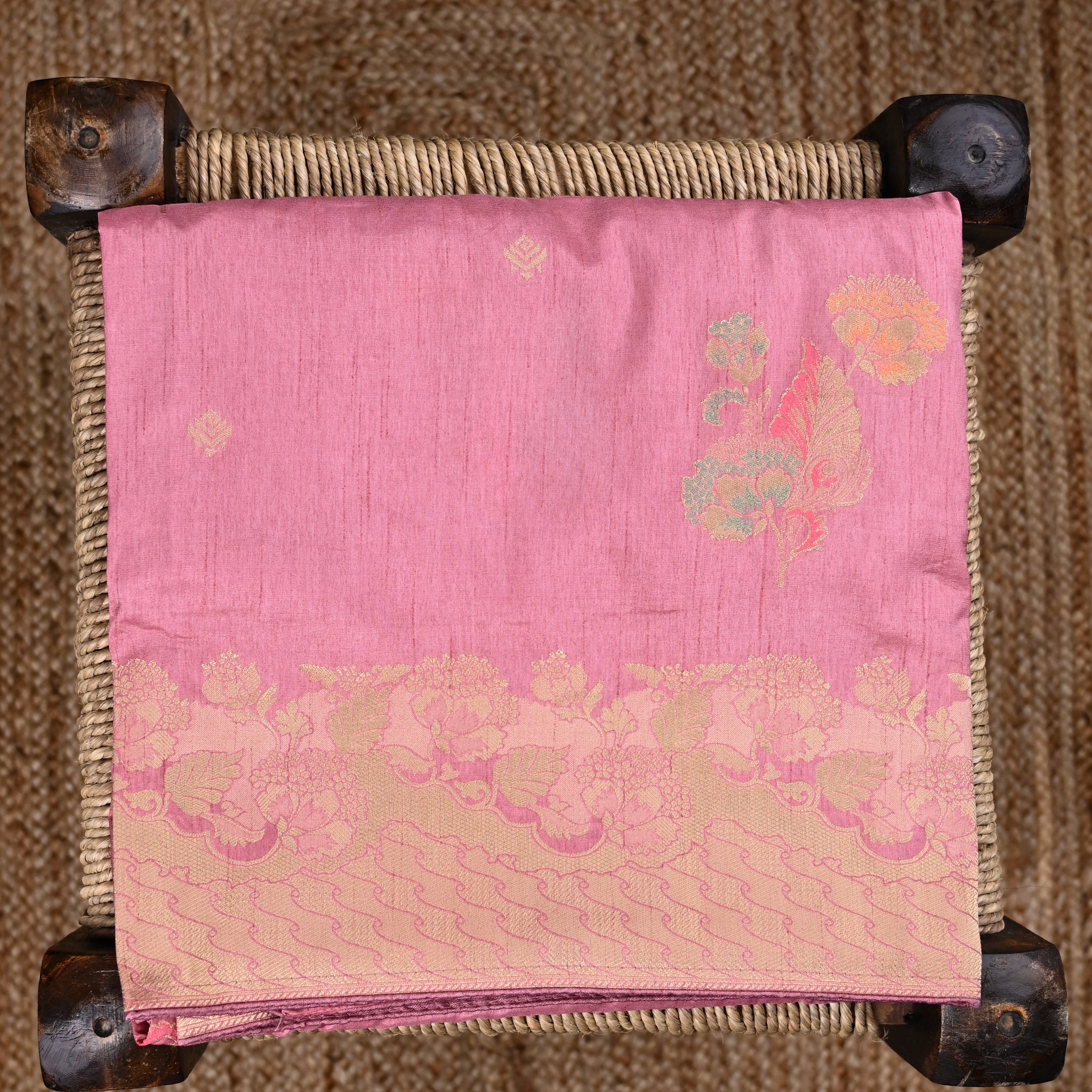 Dola silk saree baby pink color with allover meenakari motives, rich pallu, small zari border and running plain blouse.