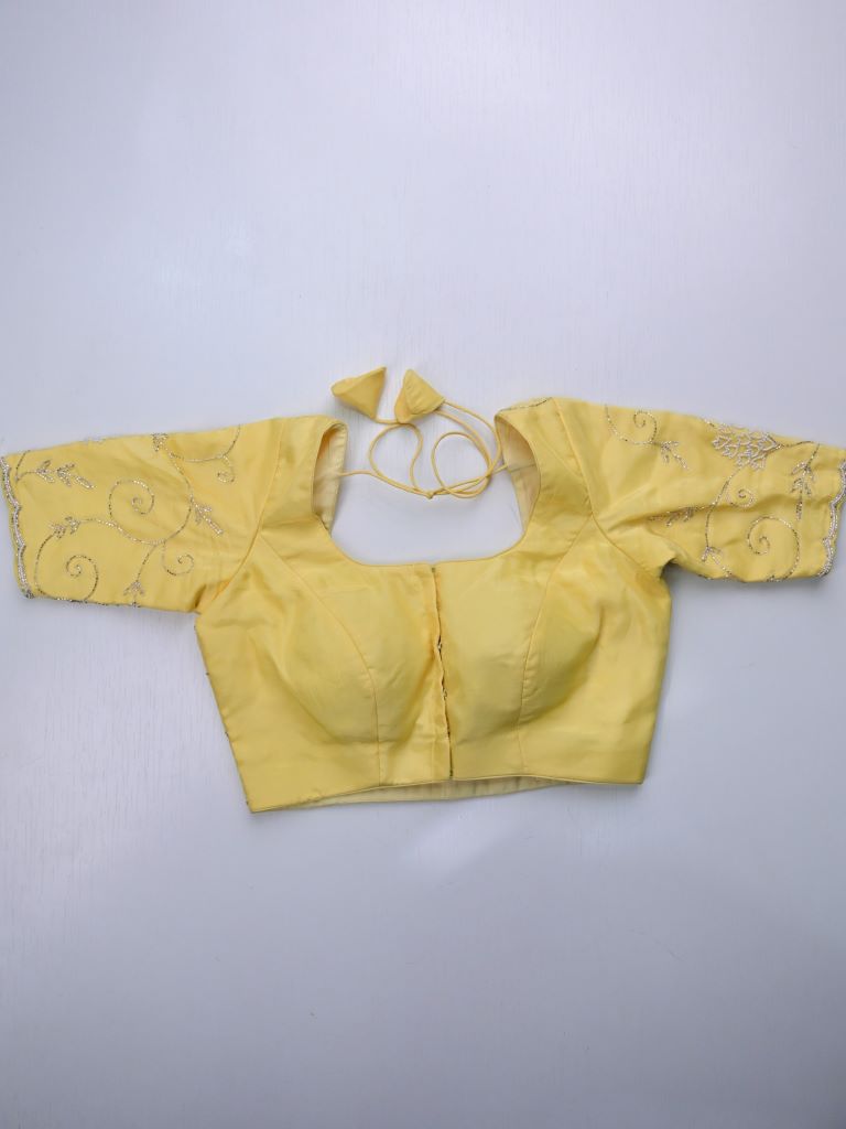 Tabby silk fancy saree light yellow color allover embroidery & cutwork border with running pallu and stitched blouse