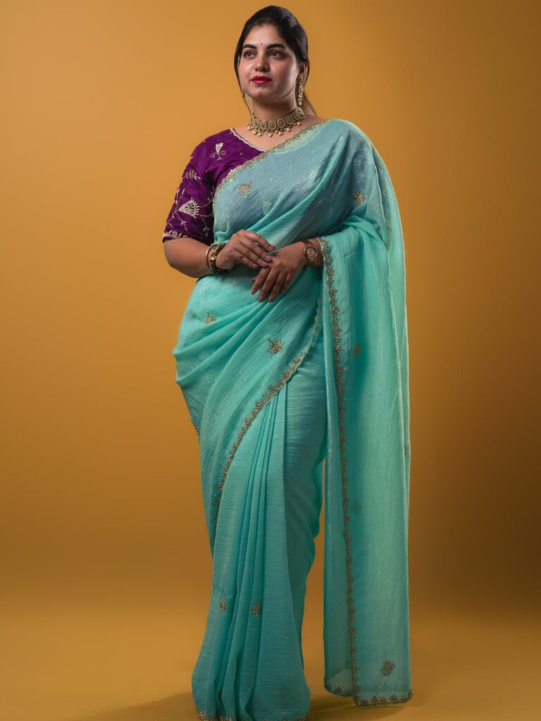 Organza shimmer sky blue color allover embroidery butis & embroidery border with running pallu and attached blouse