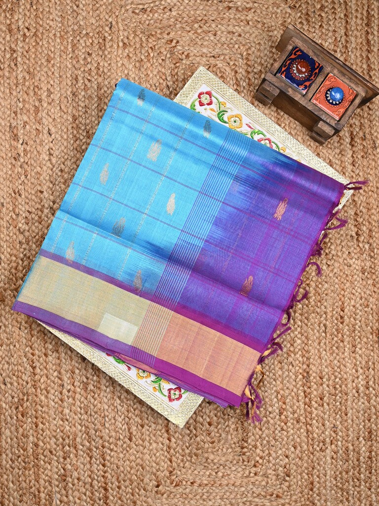 Uppada seiko pattu saree sky blue color allover zari motifs & kaddi border with contrast zari pallu and attached plain blouse