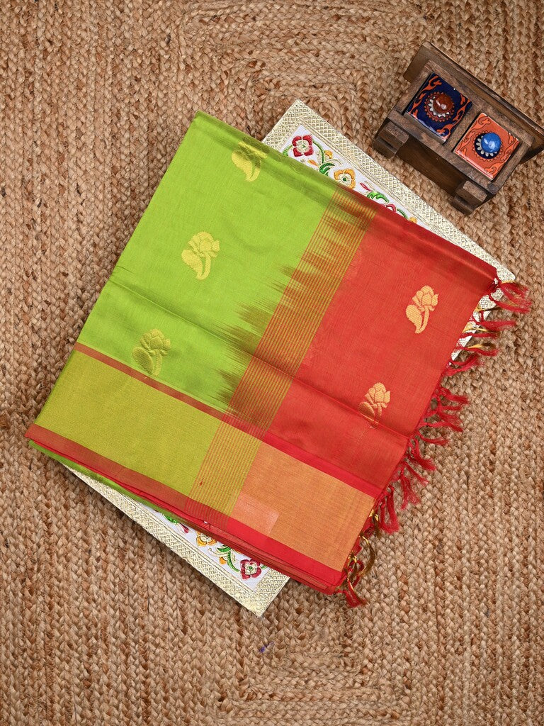 Uppada seiko pattu saree parrot green color allover zari motifs & kaddi border with zari contrast pallu and attached plain blouse