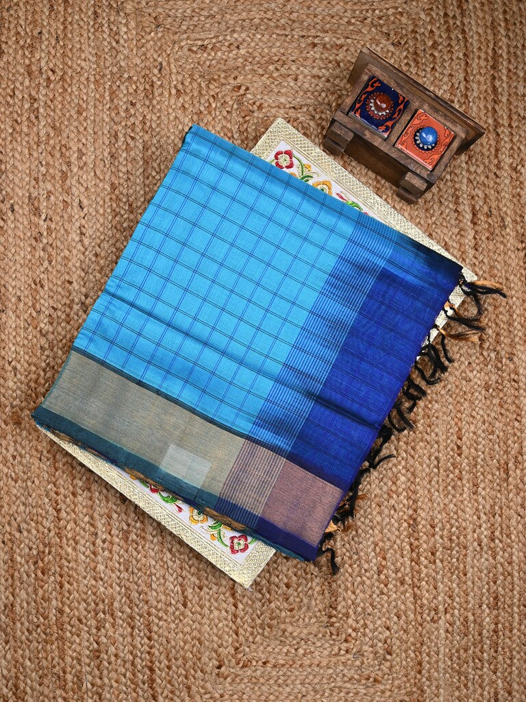 Uppada seiko pattu saree sky blue color allover checks & kaddi border with zari contrast pallu and attached plain blouse