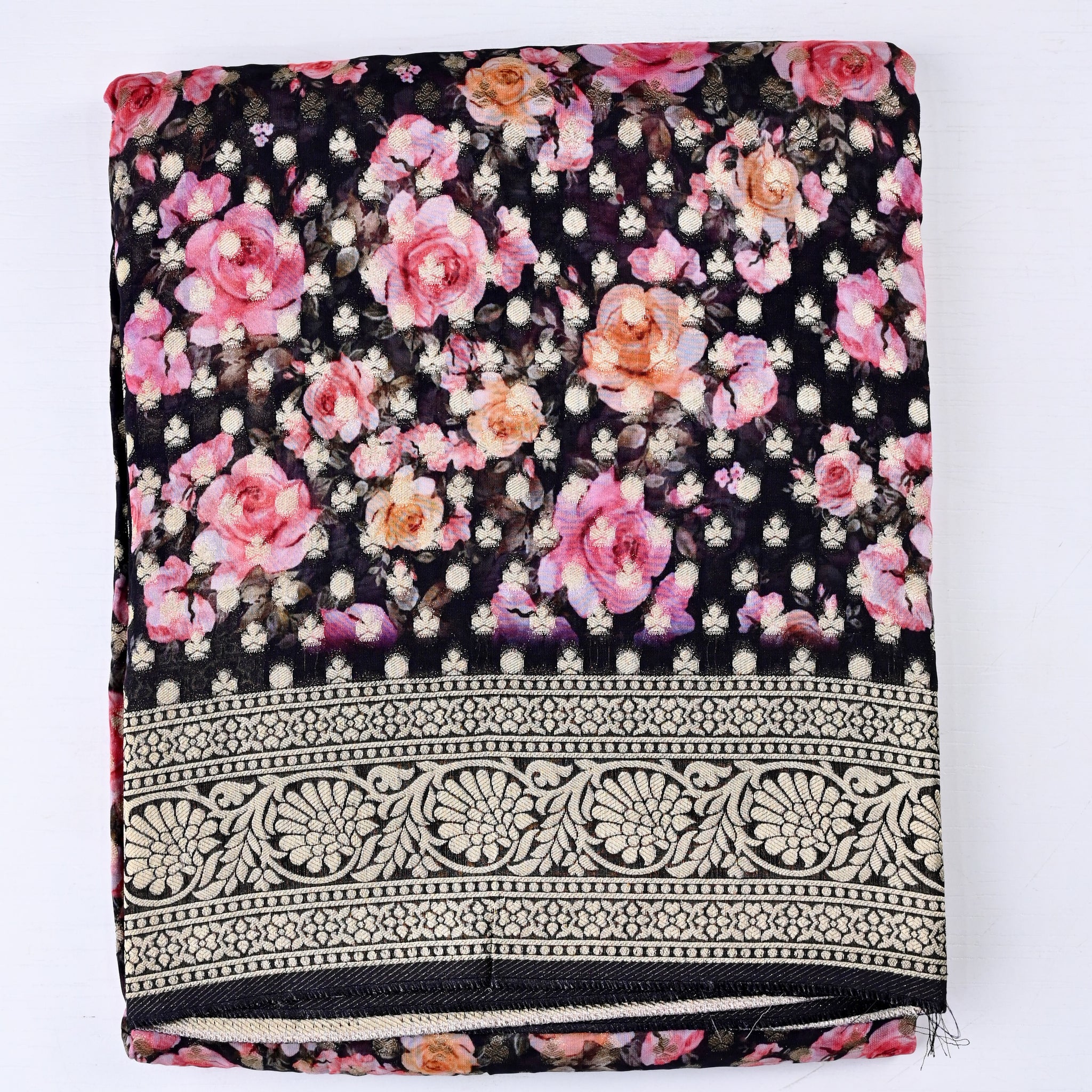 Georgette saree black color with allover zari motives and floral prints, small zari border, short pallu and printed blouse.