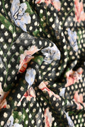 Georgette saree dark green color with allover zari motives and floral prints, small zari border, short pallu and printed blouse.