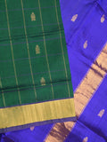 Uppada seiko pattu saree bottle green color allover zari motifs & kaddi border with contrast zari pallu and attached plain blouse