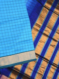 Uppada seiko pattu saree sky blue color allover checks & kaddi border with zari contrast pallu and attached plain blouse