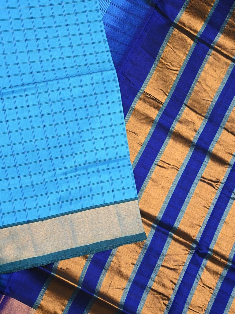 Uppada seiko pattu saree sky blue color allover checks & kaddi border with zari contrast pallu and attached plain blouse
