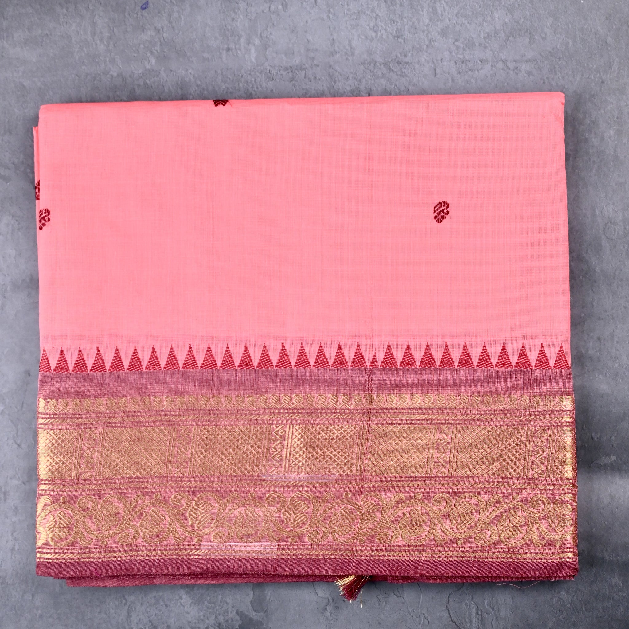 Kanchi cotton saree baby pink color with motives, running pallu, big zari border and plain blouse.