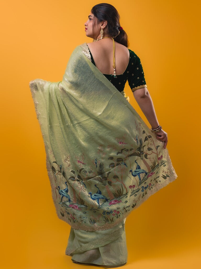 Organza crush fancy saree light pista green color allover plain & embroidery border with embroidery pallu and contrast blouse